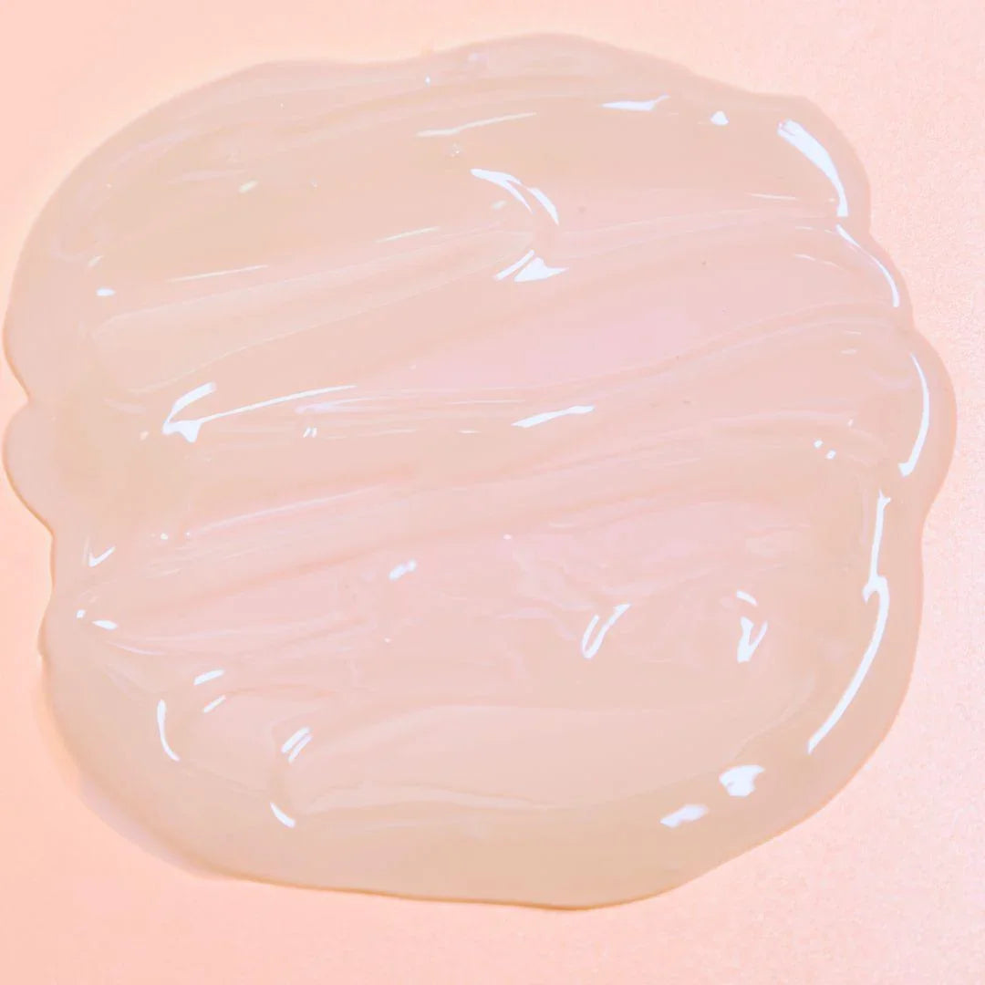 Translucent Luminous Mighty Punch Serum swatch on a pink background