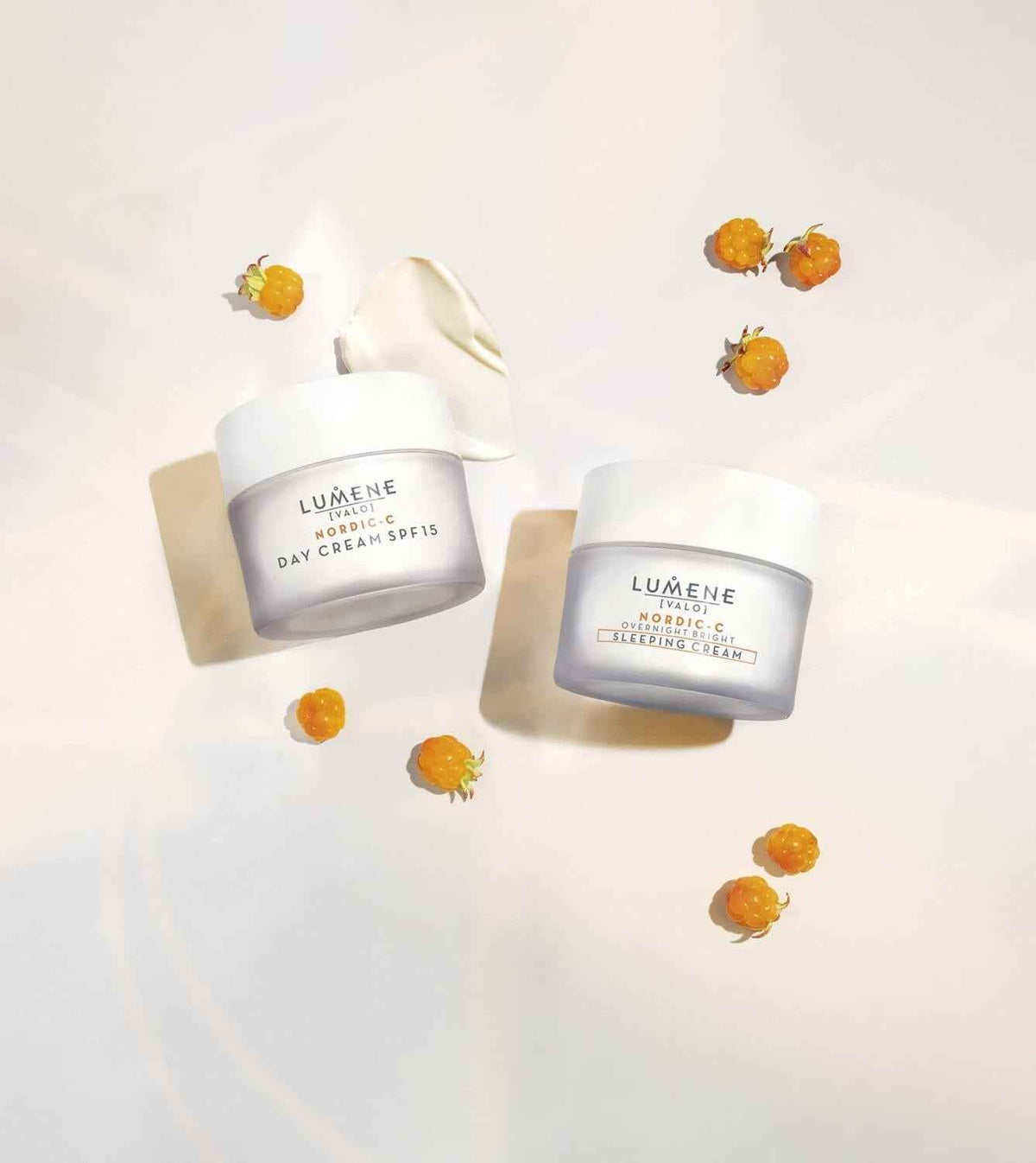 Lumene Nordic-C Day Cream SPF15 and Overnight Bright Sleeping Cream jars with orange berries