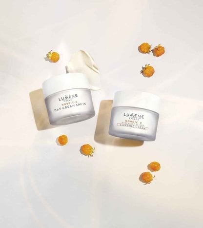 Lumene Nordic-C Day Cream SPF15 and Overnight Bright Sleeping Cream jars with orange berries
